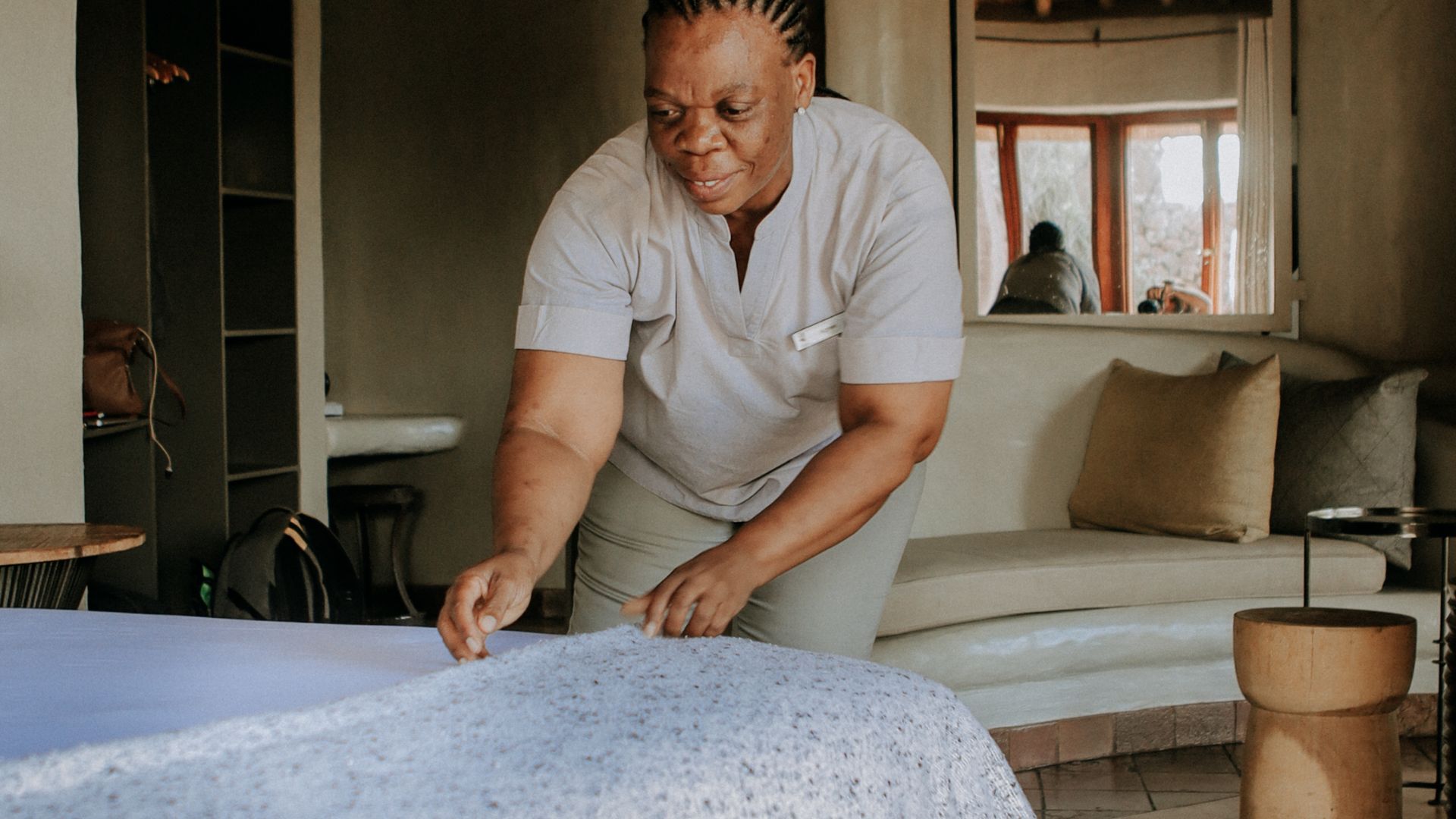 Lady making a bed